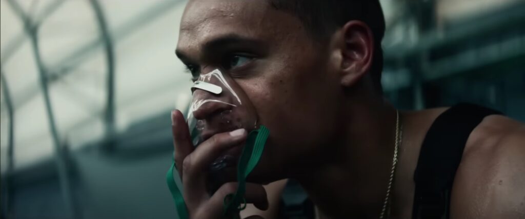 Close-up of a distressed man wearing an oxygen mask, featured in the trailer for Jordan Peele's upcoming horror film "HIM" (2025).